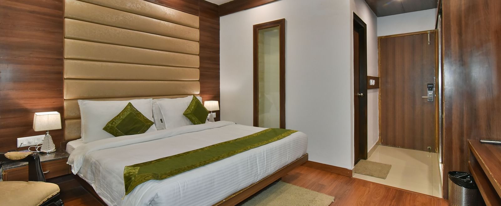A large bed in Luxury Room with Balcony at DLS Highland Resort and Spa, Mussoorie.